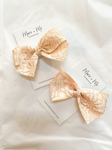charlotte bow ♡ embossed rose vegan leather